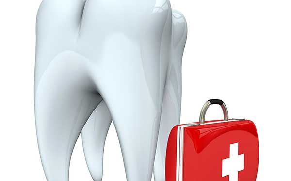 A 3D render of a large white tooth standing next to a red emergency medical kit with a white cross.