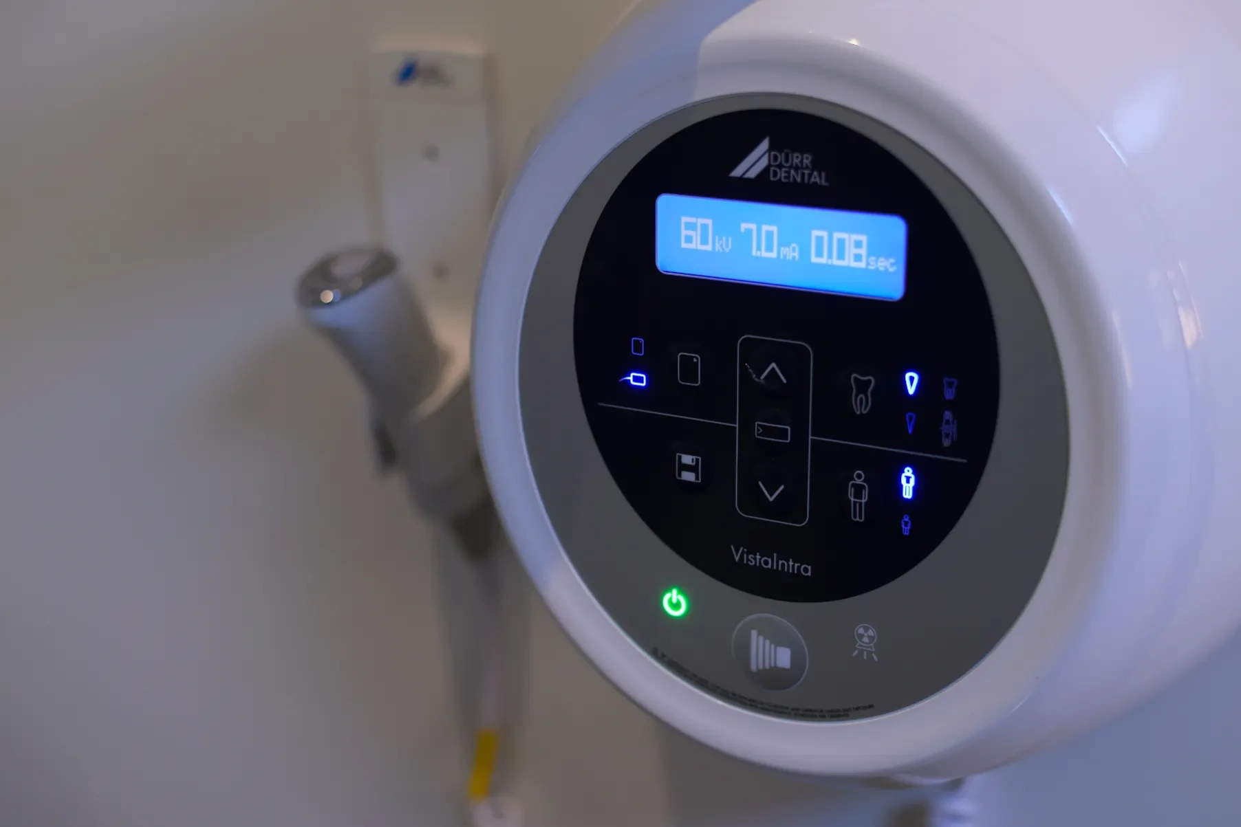 A close-up photograph of a Dürr Dental VistaIntra X-ray control panel mounted on a clinic wall.