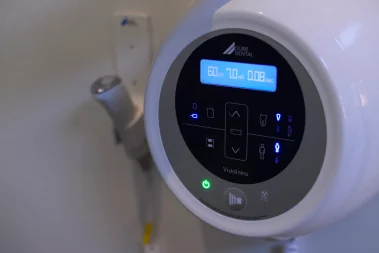 A close-up photograph of a Dürr Dental VistaIntra X-ray control panel mounted on a clinic wall.